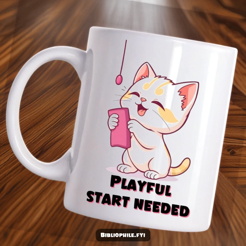 Funny kitten mug where a playful character bats at a dangling bookmark, chaotic bookish humor.