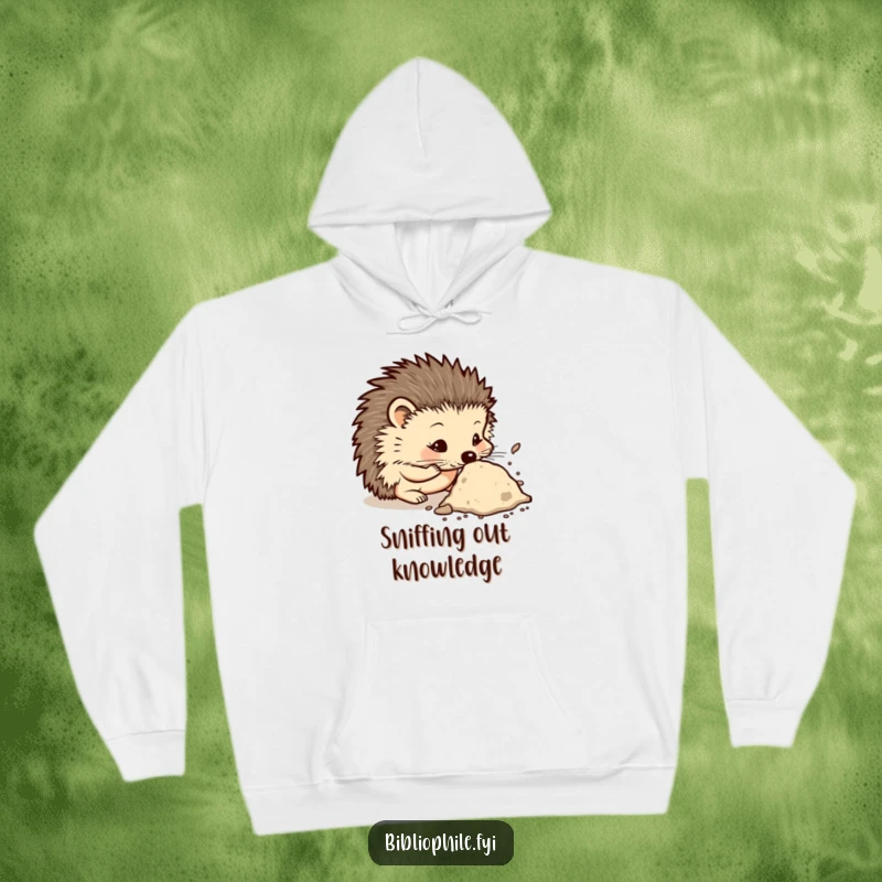 Funny hoodie with a curious hedgehog character sniffing a dusty tome, conveying a sense of intellectual exploration and appreciation for old books.
