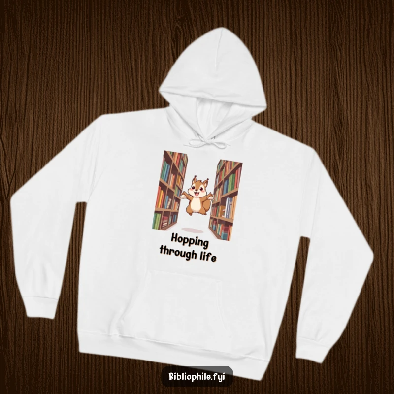 Funny hoodie with an energetic squirrel character leaping between bookshelves, conveying a sense of excitement and literary exploration.
