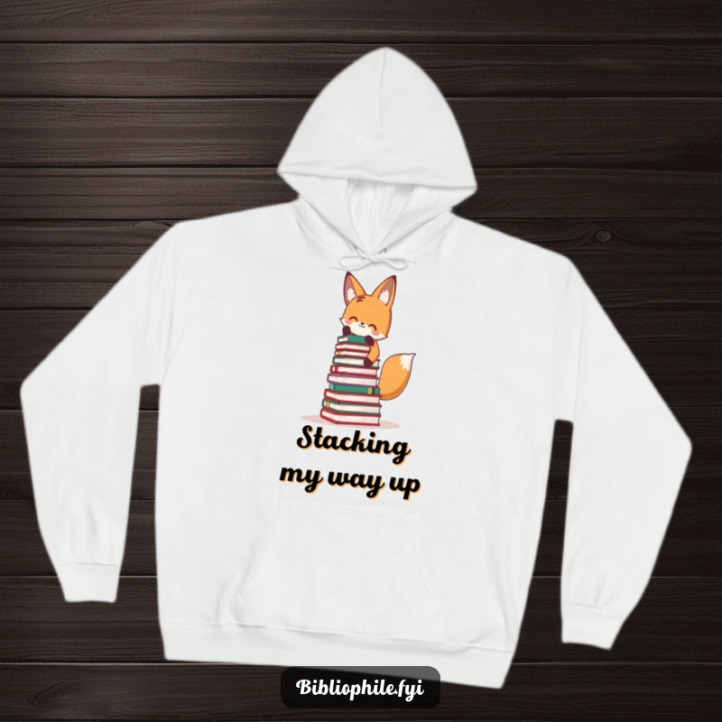 Funny Fox Hoodie: Adorable fox stacking a massive tower of books, a humorous design for readers.