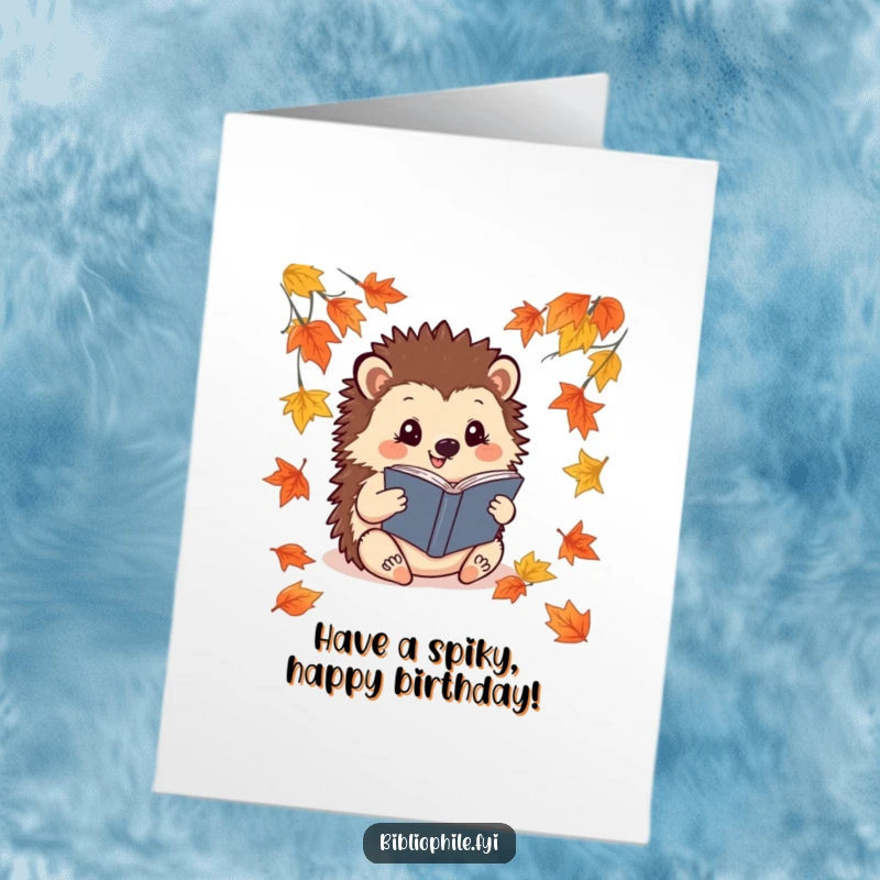Funny Free Printable Birthday Card: A cheerful hedgehog reading a book amidst fallen leaves, wishing a happy birthday.