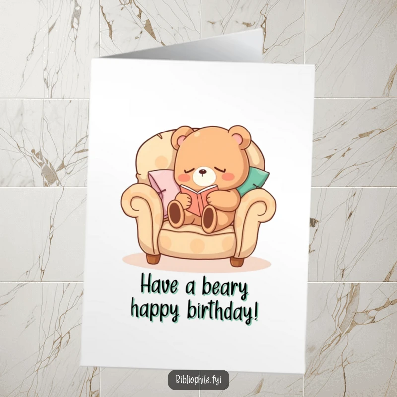 Funny Free Printable Birthday Card: A sleepy bear reading in a pillow armchair, wishing a cozy birthday. Downloadable art.