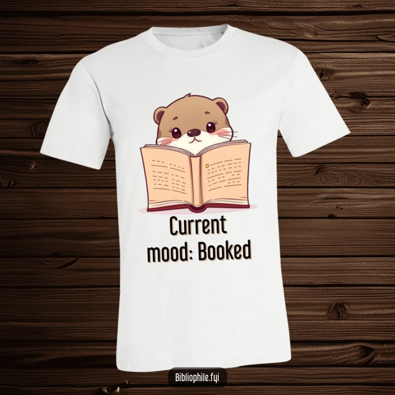 Funny t-shirt featuring a curious otter peeking over an open novel, celebrating reading and witty charm.
