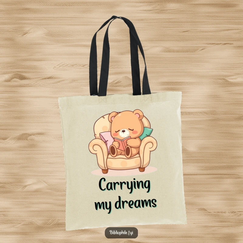 Funny Sleepy Bear Tote Bag featuring a sleepy bear character curled up on a comfortable armchair made of pillows, reading, perfect for book transport.